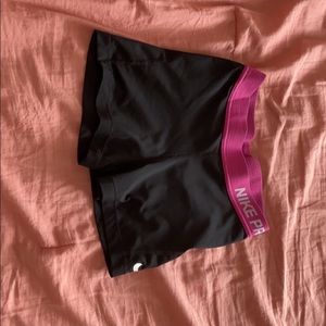 Black and pink nike pros